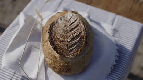 lovely curved sourdough bread on a wooden table