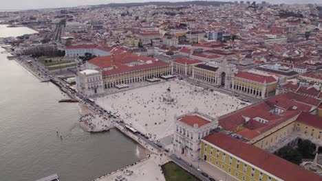 Commerce-Square,-the-most-famous-square-in-Lisbon-city-by-Tagus-river,-Aerial-Orbiting-shot