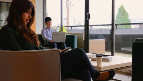 side view of young asian business people working on digital tablet and laptop in modern office 4k