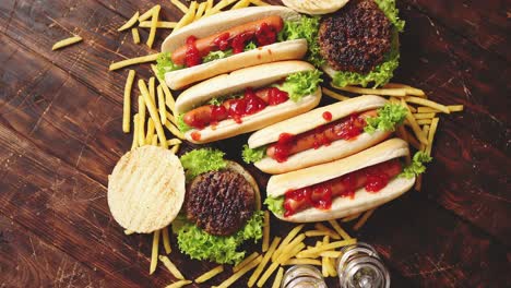 Fastfood-assortment--Hamburgers-and-hot-dogs-placed-on-rusty-wood-table