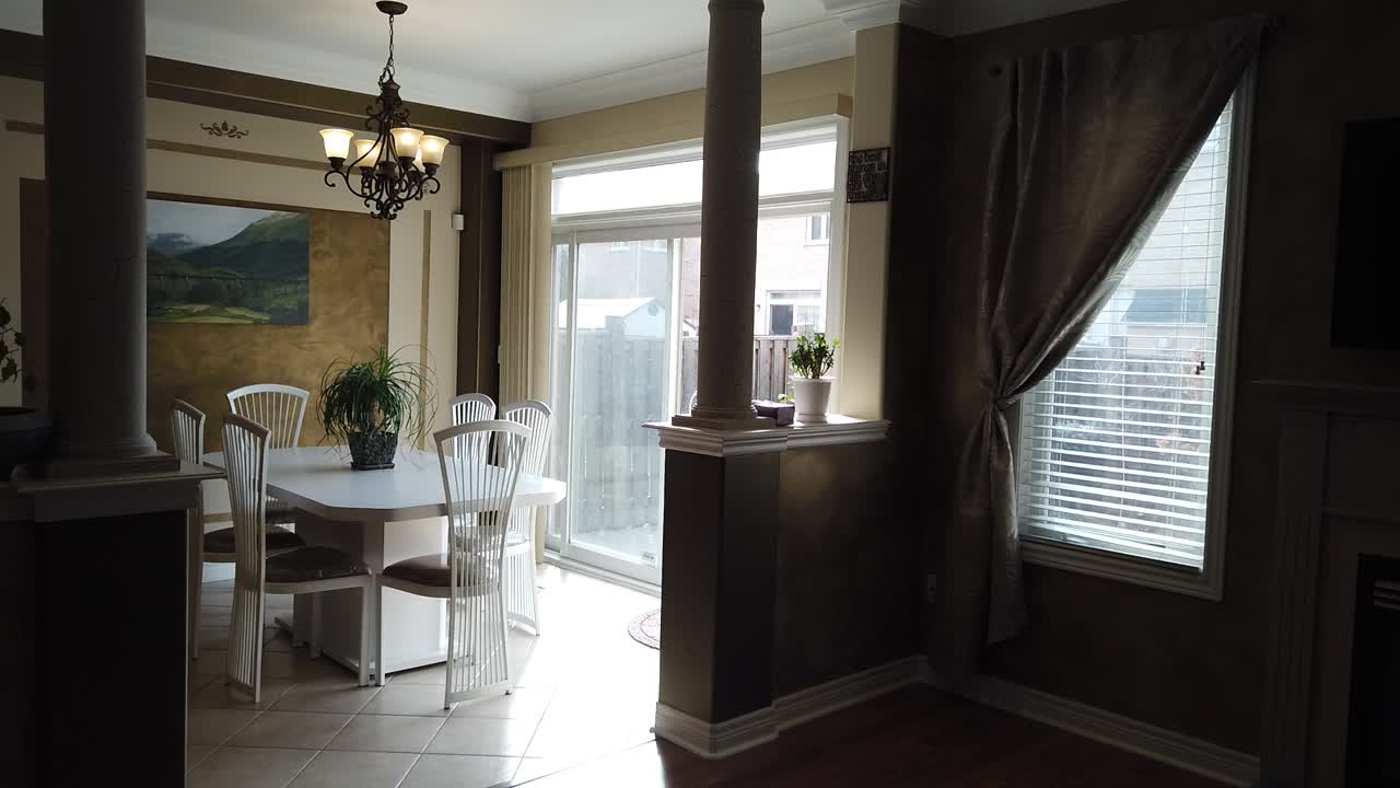 Bright and Modern Dining Room with Backyard View