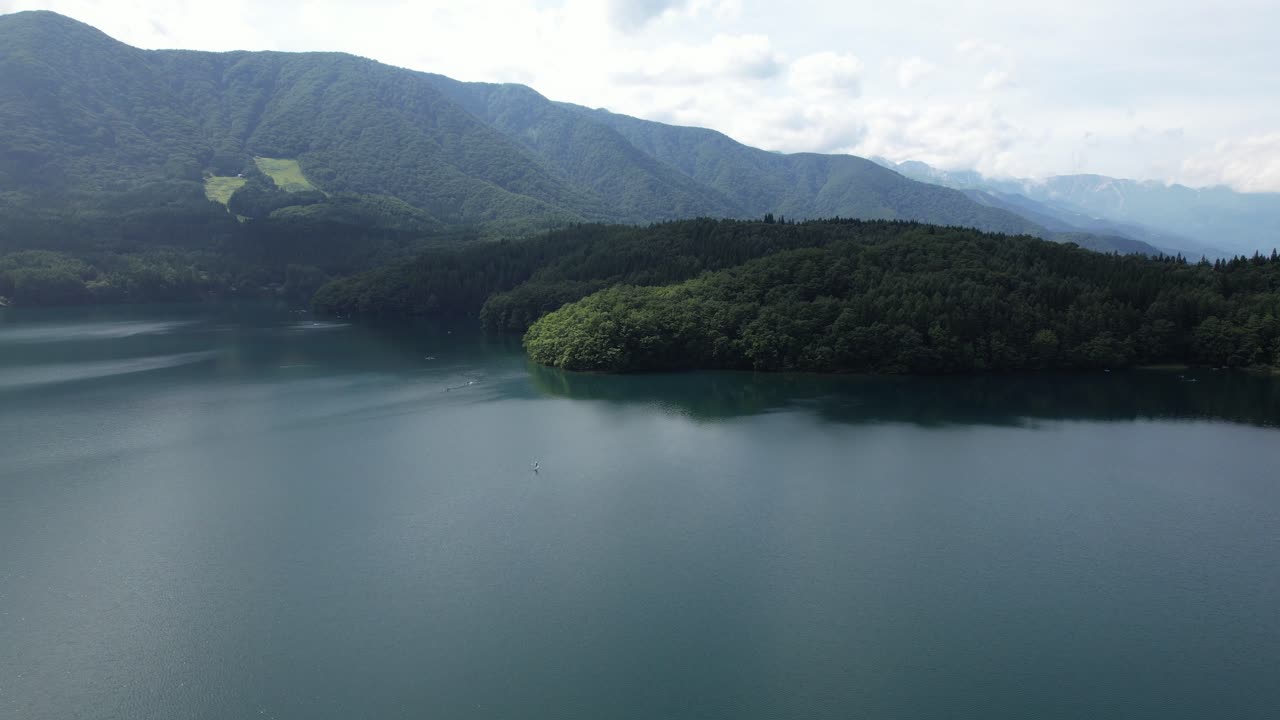 Mountains Covered With Dense Forest In Lake Aoki In Omachi City, Nagano Prefecture, Japan. Aerial Wide Shot