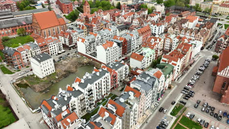 aerial establishing shot of medieval old town with ancient architectural polish style buildings