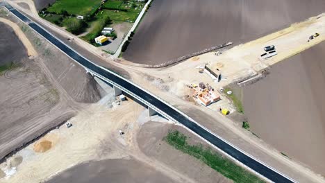 aerial - overpass and railroad construction, baden, austria, wide spinning shot