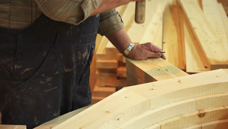 carpenter building wooden arch