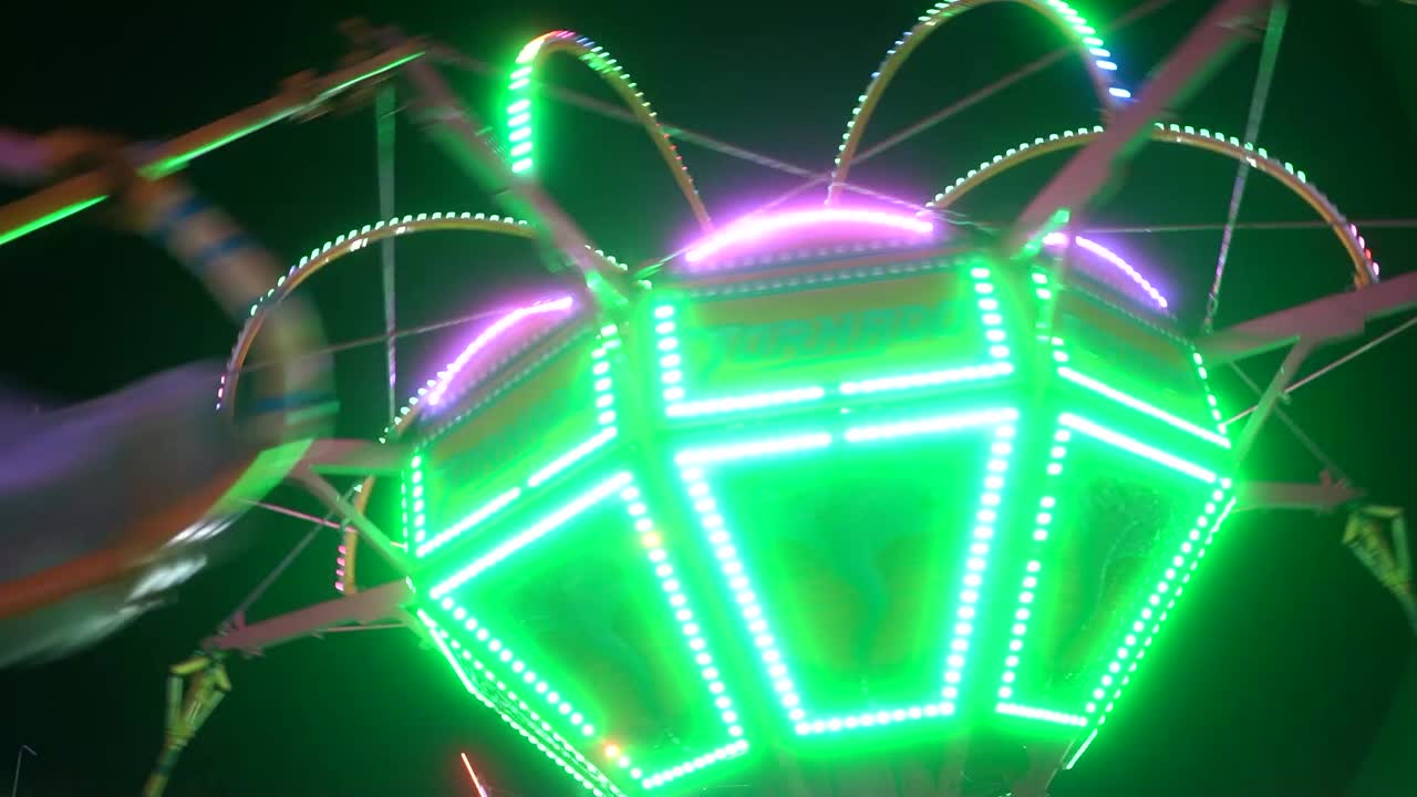 Colorful carnival ride at night