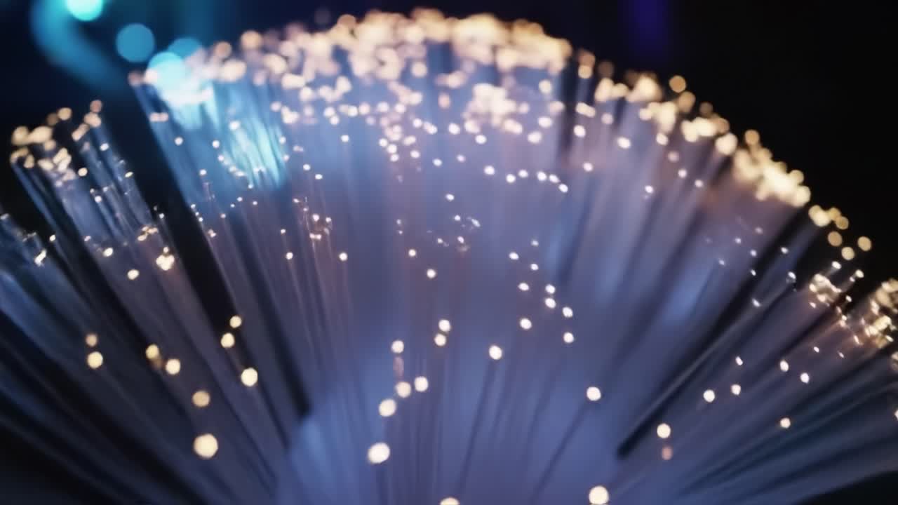 Colorful fiber optic lights twinkle and sparkle in a dark environment, creating an enchanting display that captivates viewers. The glow enhances the vivid mood of the setting.