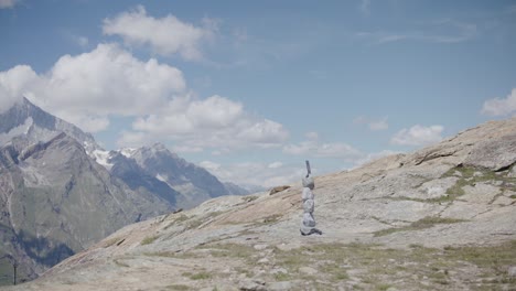 fast moving clouds over mountainside near the matterhorn in switzerland