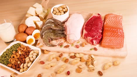 variety of meats, nuts, and dairy products shown