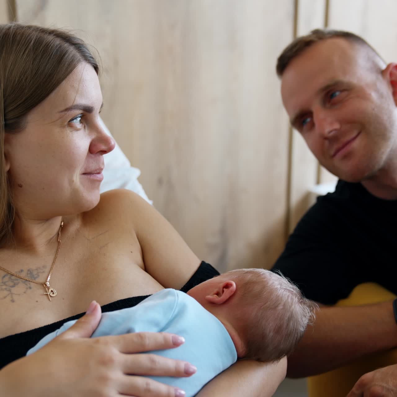 Beautiful young family of three together. Parents and their newborn boy. Happiness and love concept