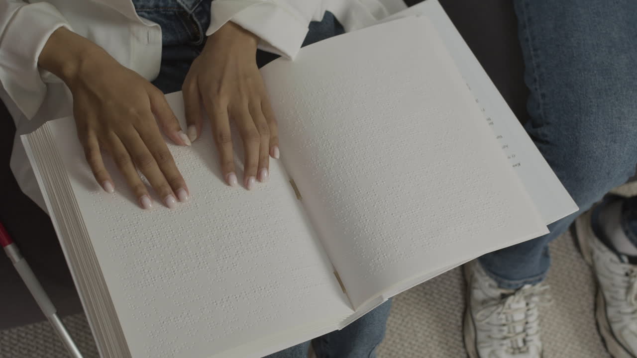 Top view of woman hands touching a book