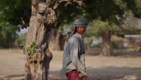 elderly man walking in a rural setting