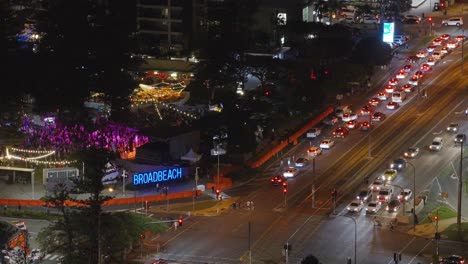 aerial view of vibrant night traffic at broadbeach, gold coast, showcasing illuminated streets and bustling vehicular movement