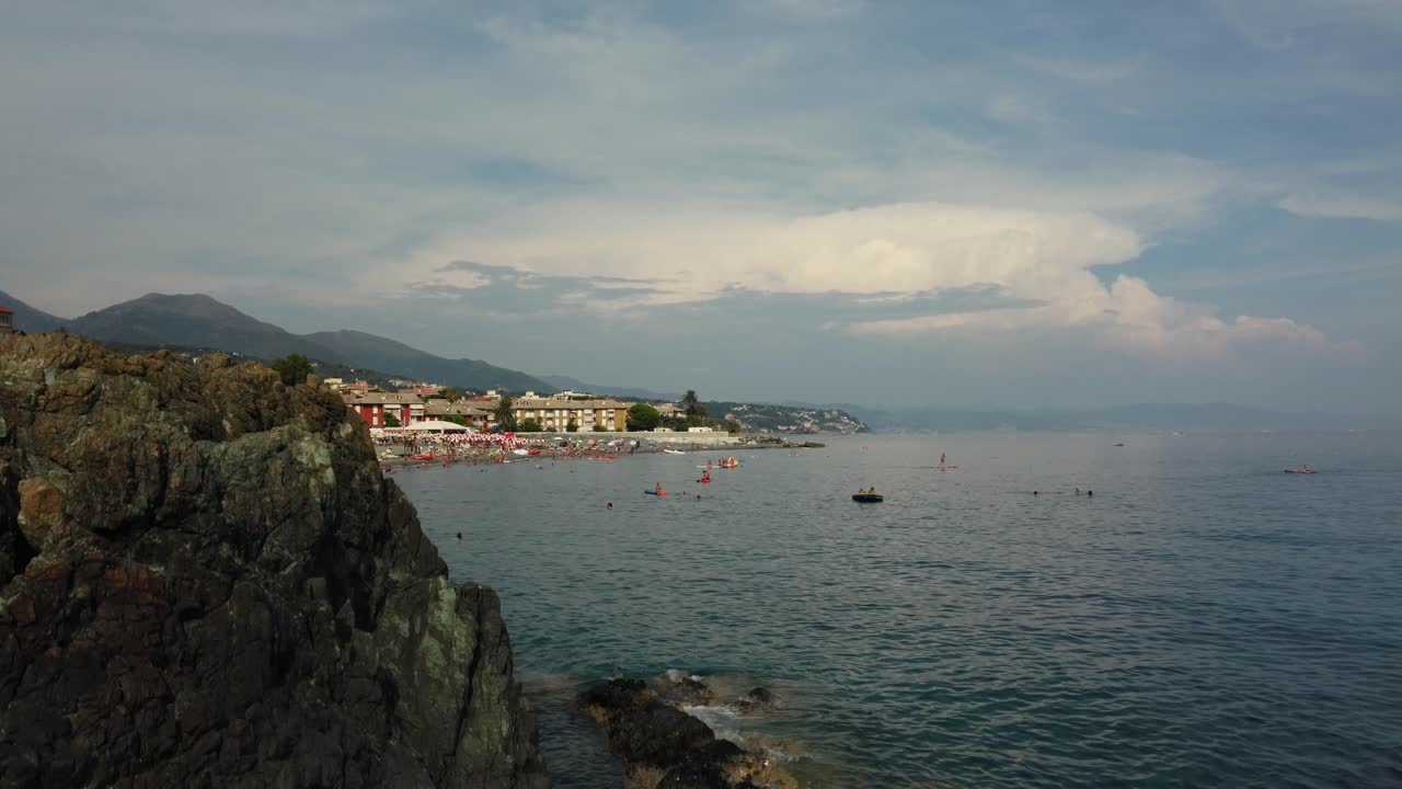 Coastal Scenery with Rocks, Beach and Buildings