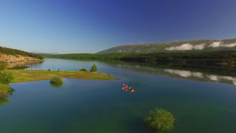 people kayaking in river, green nature and blue sky