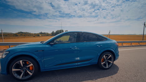 speeding audi e tron on the highway. new audi e tron fully electric vehicle ob highway