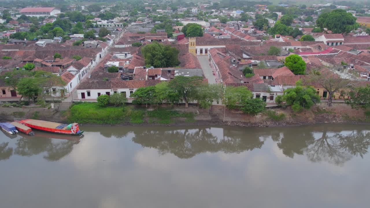 The gentle motion captures the timeless beauty of Mompox, where history and nature blend seamlessly, creating a mesmerizing dance between land, water, and sky."