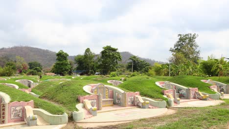 peaceful graveyard with lush greenery and hills