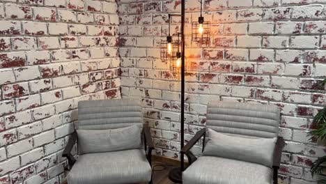 cozy industrial living room with grey chairs and floor lamp