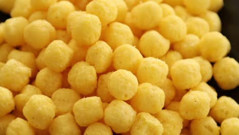 puffed golden cheese balls rotating 1