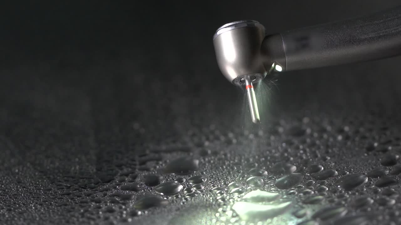 Dental Drill in Action with Water Spray Cooling