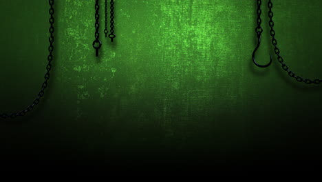 metal chains with hooks hang from rough, green wall