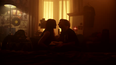 couple in a dark bedroom