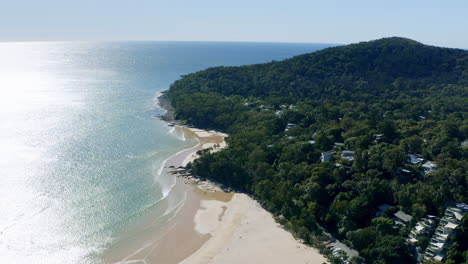 aerial drone over scenic noosa heads headland with ocean view in afternoon light, 4k