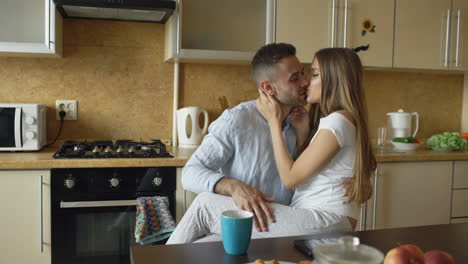 couple using tablet in kitchen