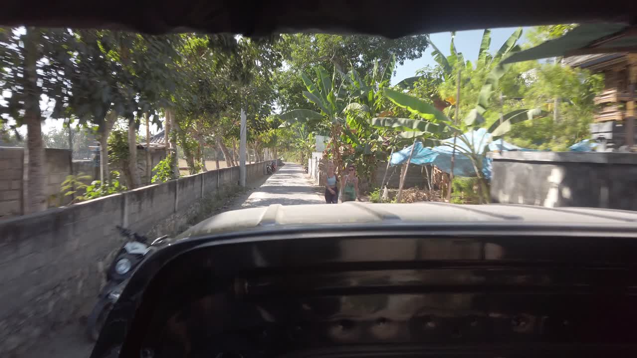 Nusa Lembongan transportation driving in the small track around the island with locals. Great tropical rural place with great service.