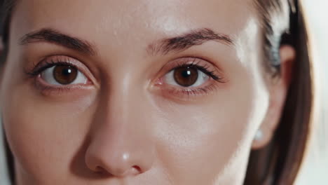 close-up of a woman's eyes and face, focusing on natural beauty and skincare