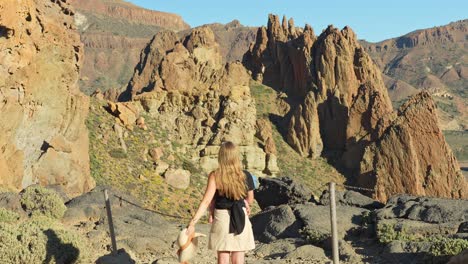 Woman-with-child-in-Teide-national-park-looking-at-the-view-from-top