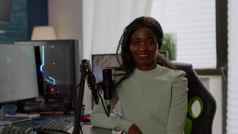 Portrait-of-excited-african-professional-streamer-player-looking-at-camera