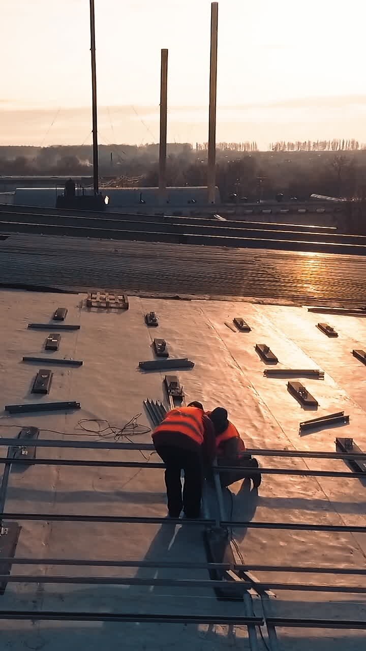 Electrician installing solar panel. Technician install new generation photovoltaic solar panels on roof