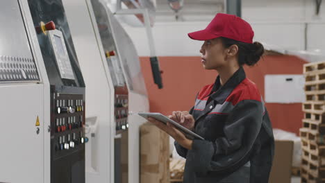 female factory worker with digital tablet