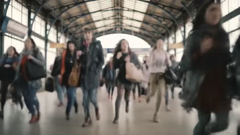 a busy train station adventure: capturing the hustle and bustle of commuters in motion as they navigate through the arrival hall with purpose and determination