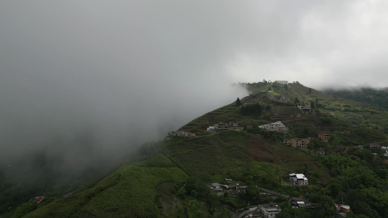 Bird-eye aerial drone view of a Misty Mountain From Bird-Eye View with Foggy ambience.
