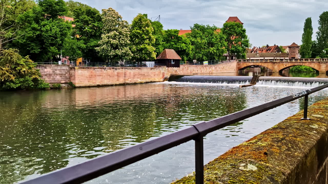 Maxbrücke bridge and Pegnitzwehr weir over Pegnitz River in Nurnberg, Germany