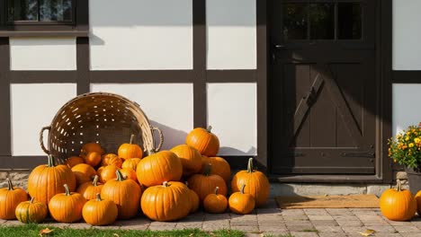 autumn pumpkin display at a rustic house entrance