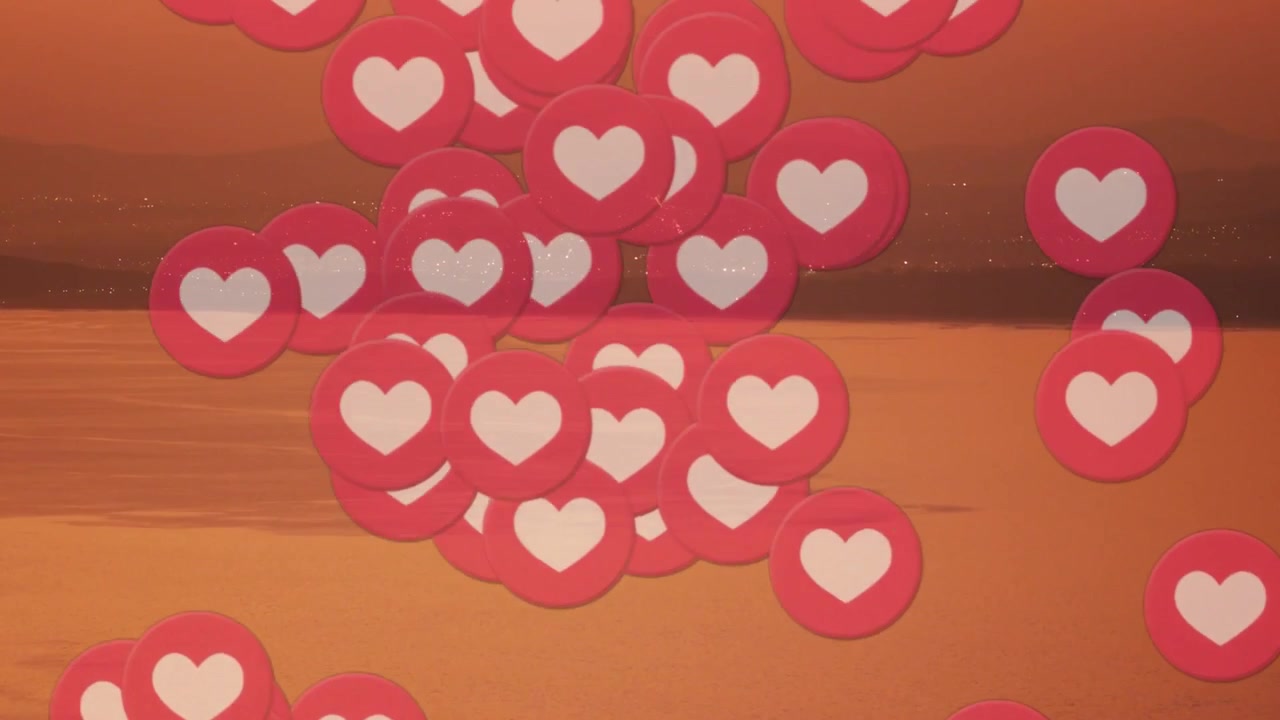 Token a forma di cuore rosa che cadono dal bordo superiore, raggruppandosi e poi disperdendosi, mostrando like su un mare arancione.