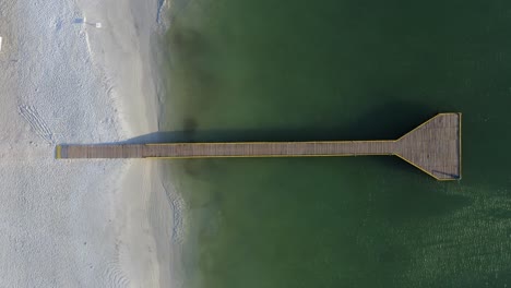 view from above of pier and sandy beach of coche island, venezuela in south america