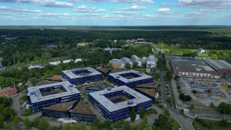 hennigsdorf, germany, showcasing residential areas, railway infrastructure and commercial buildings. amazing aerial view flight static tripod hovering drone