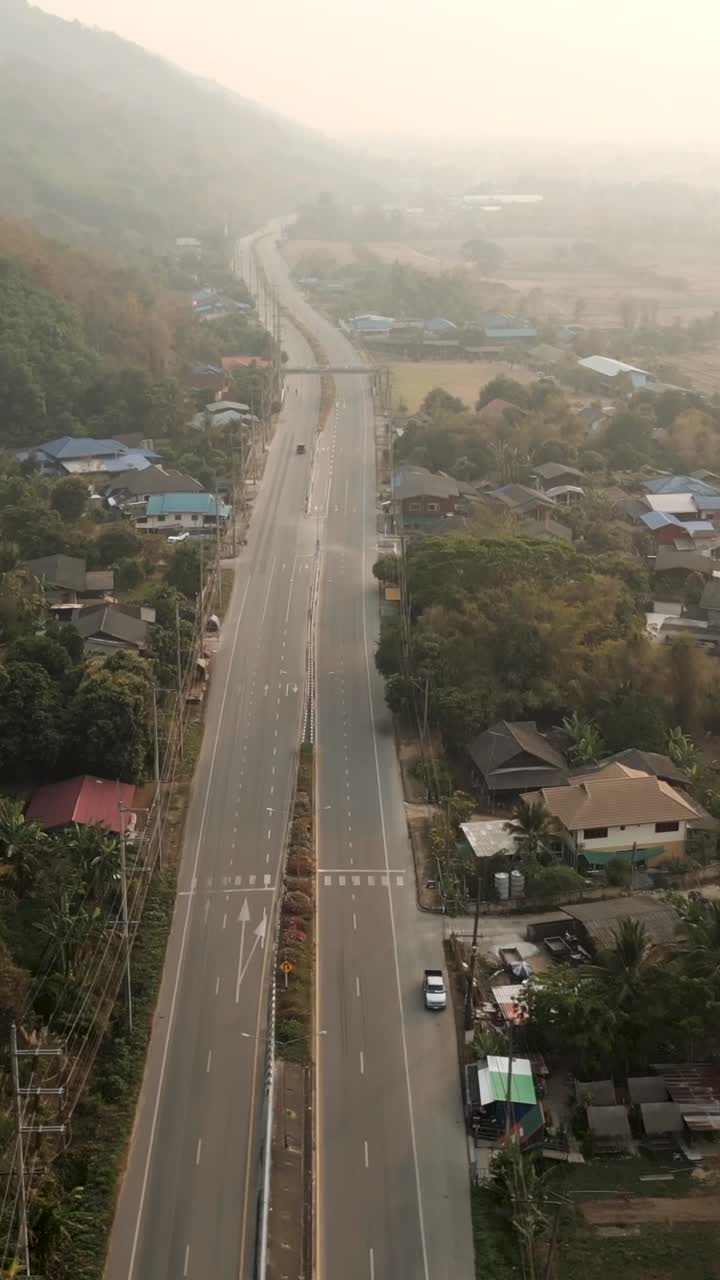 Aerial view of a road passing through a village
