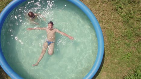 Flying-over-children-in-the-pool-and-countryside-houses-Russia