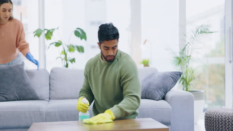 Couple,-home-and-cleaning-together-in-living-room