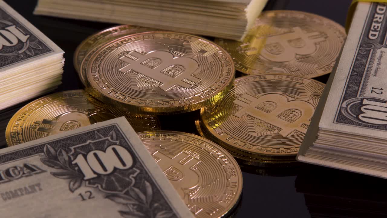 Turning golden bitcoins surrounded with stacks of hundred dollar bills on black background, cryptocurrency investment