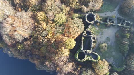 old fashioned liverpool castle replica ruins in autumn rivington woodland nature landmark aerial view rising