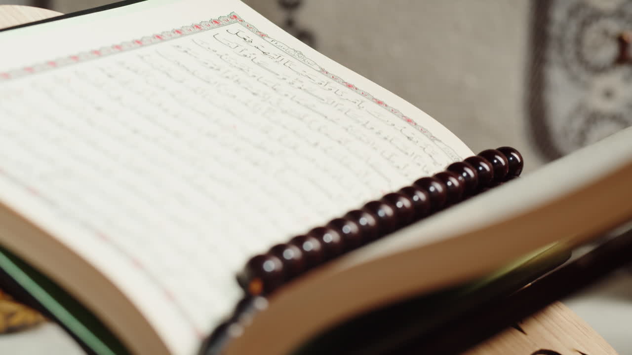 Quran book close-up, praying, islamic religion. Religious holiday Ramadan, holy month. Worship, making traditional prayer to God