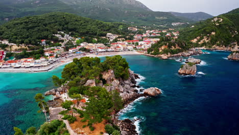scenic aerial view of a coastal village and turquoise bay