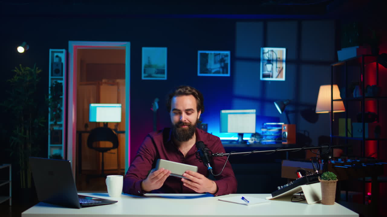 Jolly influencer presenting music playing device